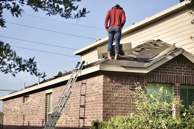 Professional roofer working on a residential roof in Colleyville
